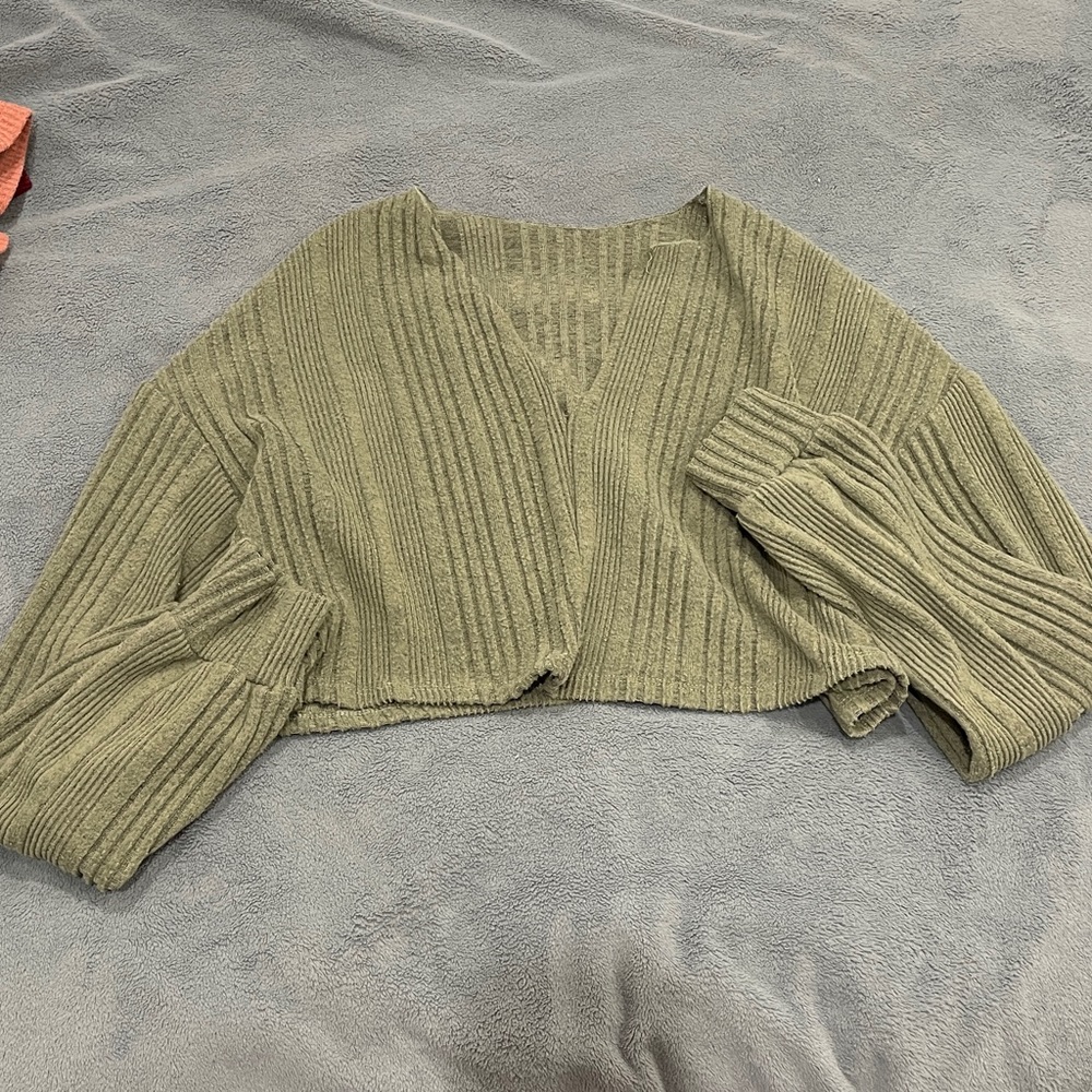 Very cropped green crop top. Size small. Only worn once or twice.